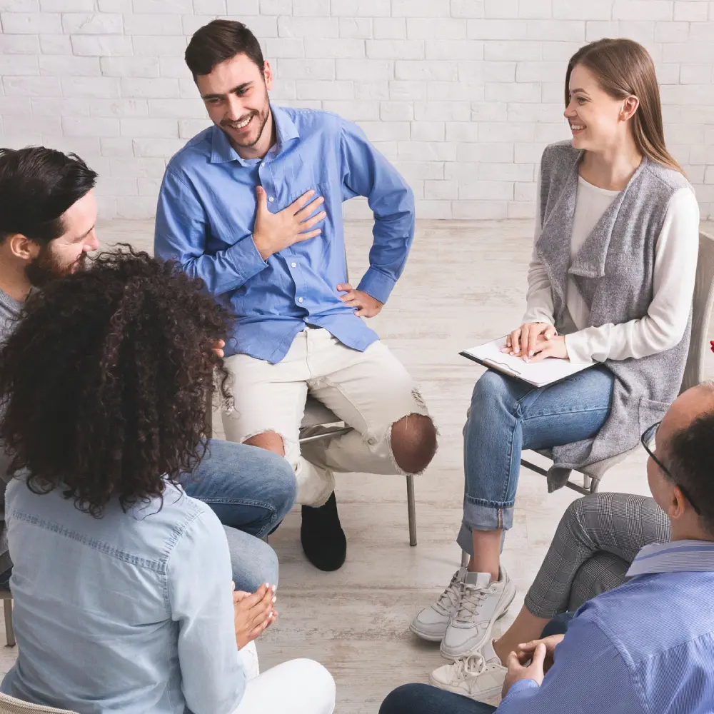 Group therapy session with casual conversation