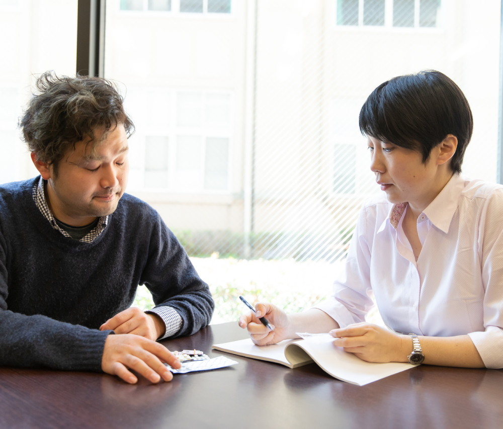 Office meeting with papers and pens